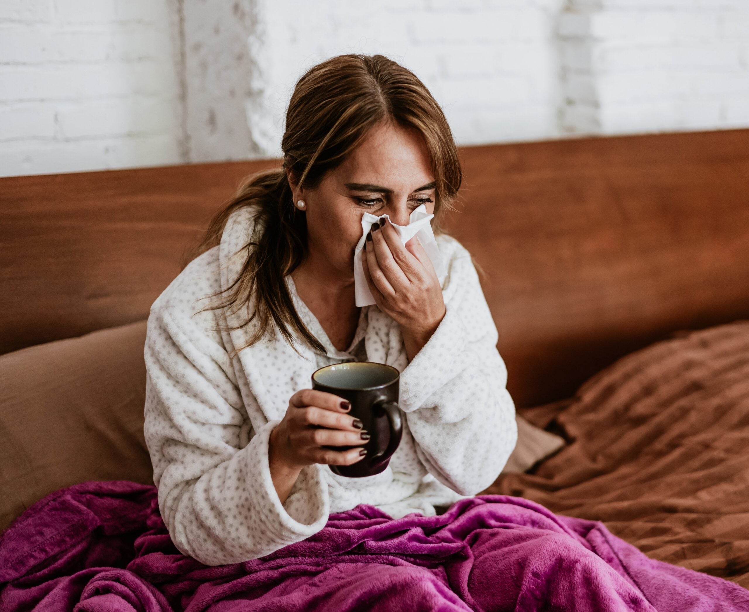 Sick person blowing their nose